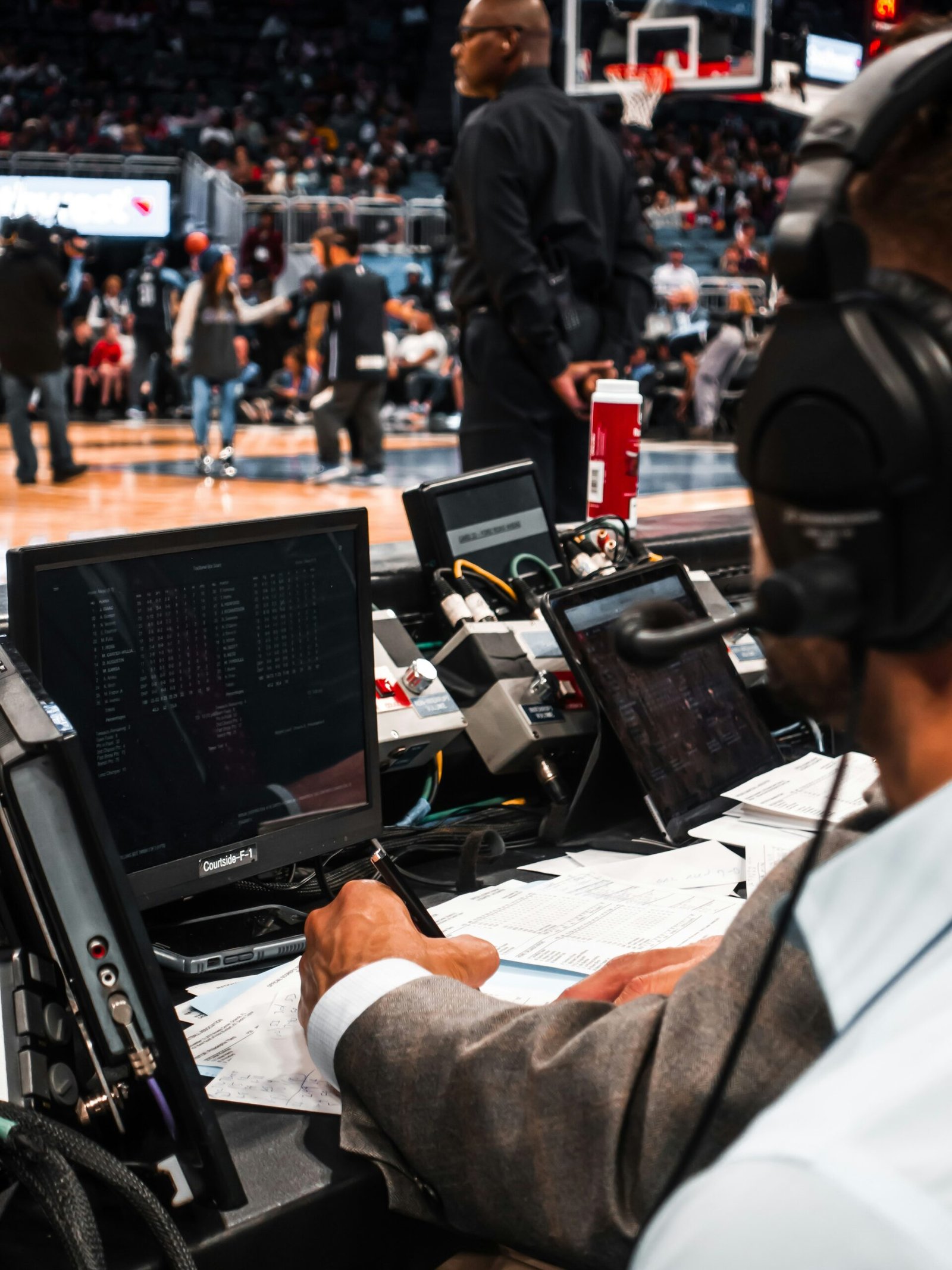 man in black jacket using computer